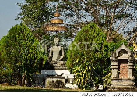 The outdoor sitting stone Buddha statue decoration at Wat Den Sali Si Mueang Kaen temple or Wat Ban Den. Located at Chiang Mai Province in Thailand. The outdoor sitting stone Buddha statue decoration at Wat Den Sali Si Mueang Kaen temple or Wat Ban Den. Located at Chiang Mai Province in Thailand. 130730595