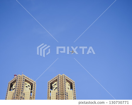 A clear blue sky with planes passing over the Tokyo Metropolitan Government Building. A clear blue sky with planes passing over the Tokyo Metropolitan Government Building. 130730771