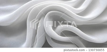 Elegant White Chiffon Fabric Draped with Graceful Curves and Soft Folds, Creating Dynamic Textures 130730855