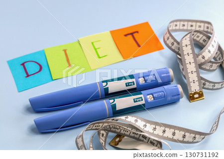 Ozempic pen for weight loss and diet abbreviation on multi-colored paper 130731192