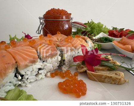 take a spoonful of red caviar from a glass jar Red salmon salted roe caviar in big jar. Tasting salmon caviar salted roe. Hand with spoon takes of caviar from the glass bowl close-up slow motion 130731326