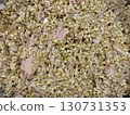 Overhead view of freekah and shredded meat pilaf in pot, homemade comfort food, healthy protein rich meal, rustic culinary tradition, and nutrition background 130731353