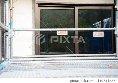 A house under construction with glass windows 130731827