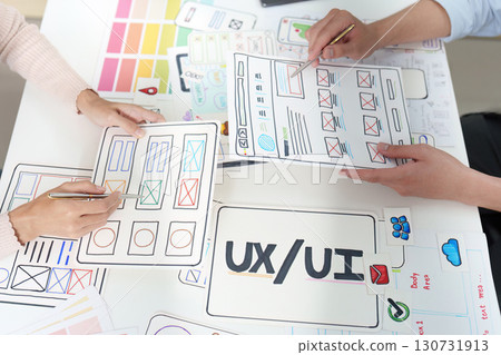 UXUI Design Collaboration. Team brainstorming and sketching user interface concepts. UXUI Design Collaboration. Team brainstorming and sketching user interface concepts. 130731913