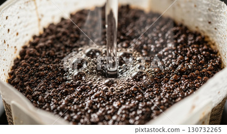 Close Up of Drip Coffee Grounds with Hot Water 130732265