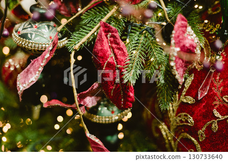A Christmas tree with red and green ornaments 130733640