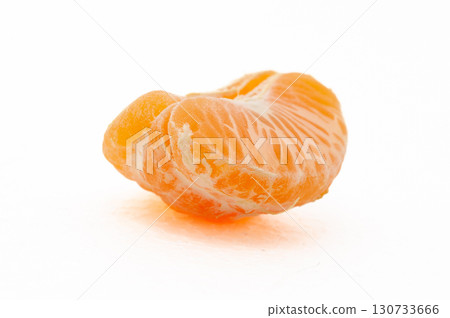 A slice of orange mandarin with a white background A slice of orange mandarin with a white background 130733666