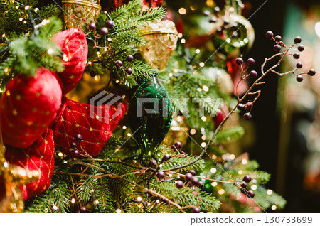 A Christmas tree with red and green ornaments A Christmas tree with red and green ornaments 130733699