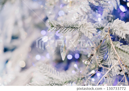 A tree with a crystal ornament hanging from it 130733772