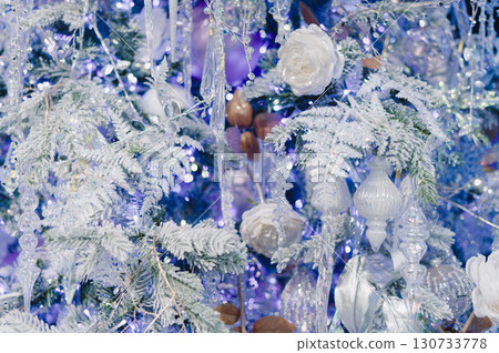 A white flower is in the center of a blue background A white flower is in the center of a blue background 130733778