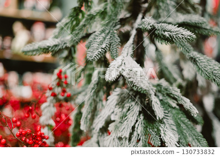 A tree with red berries and white snow. Christmas 130733832