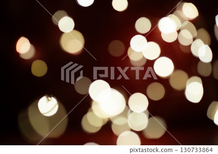 A blurry image of a red background with many white circles 130733864