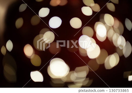 A blurry image of a red background with many white circles 130733865