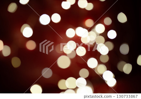 A blurry image of a red background with many white circles A blurry image of a red background with many white circles 130733867