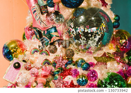 A Christmas tree with many colorful balls and a star 130733942