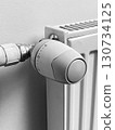 A radiator with a thermostat on it 130734125