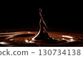 Chocolate drop is falling into a pool of chocolate. Moody and dark atmosphere 130734138