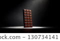Chocolate bar is shown in a dark room 130734141