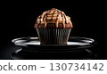 Chocolate cupcake with chocolate drizzle on top 130734142