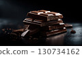 Stack of chocolate bars with a pile of chocolate chips on the ground. Luxury chocolate. 130734162