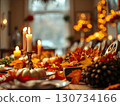 A table is set for a Thanksgiving dinner with candles, pumpkins, and leaves 130734166