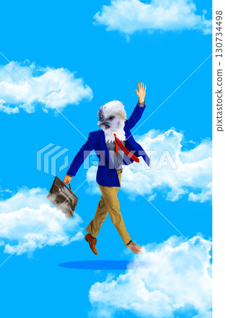Businessman with eagle head walking in clouds with briefcase in surreal collage 130734498
