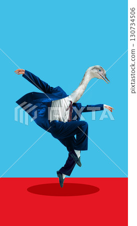 Businessman with bird head in blue suit in surreal collage on red floor 130734506
