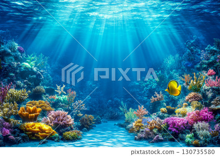 Underwater marine life landscape with colorful coral formations, vibrant sea plants, and a yellow fish swimming in clear blue water with sunbeams. 130735580