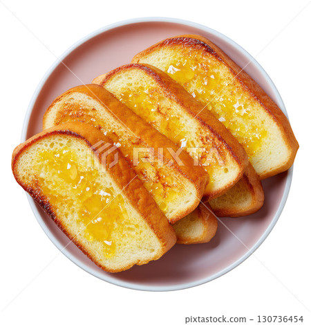 Delicious Slices of Golden Brown French Toast Topped with Butter and Sweet Maple Syrup on a Pink Plate 130736454