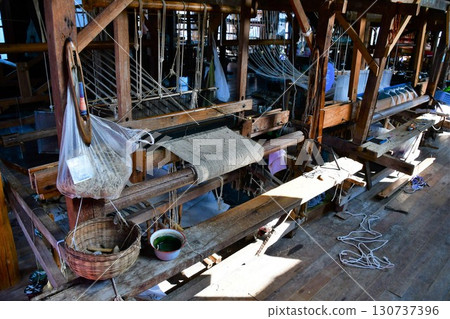 Myanmar, Inle Lake, weaving workshop, loom 130737396