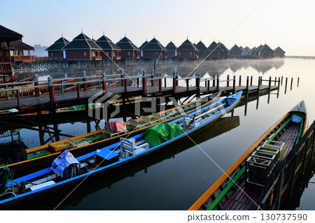 Myanmar, Inle Lake, floating cottages, tourist boats Myanmar, Inle Lake, floating cottages, tourist boats 130737590