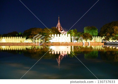 Myanmar, Mandalay, old royal palace, city walls and moat, night view, illuminated 130737633