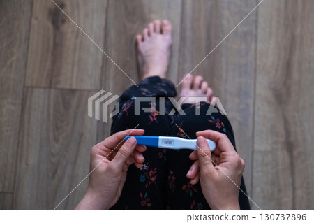 Positive Pregnancy Test in Hand 130737896