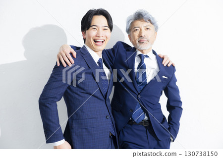 Two businessmen standing side by side 130738150
