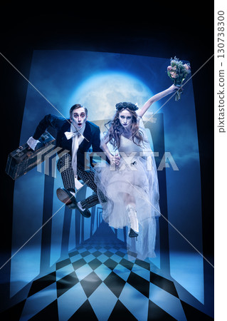 Zombie bride and groom jumping through surreal corridor with full moon backdrop 130738300