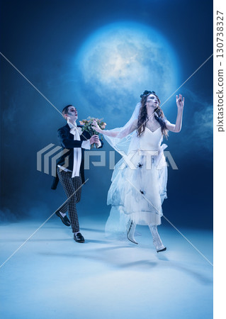 Dark romantic chase of gothic bride and groom in moonlit fantasy scene Dark romantic chase of gothic bride and groom in moonlit fantasy scene 130738327