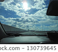 Blue sky and highway seen from the car window 130739645