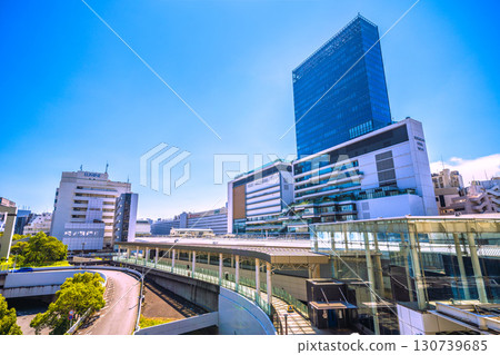 Yokohama cityscape in Japan. View of the north east exit of Yokohama Station and JR Yokohama Tower. The east exit (center) is in the back left of the screen. (Image taken on the 23rd) 130739685