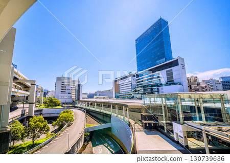 Yokohama cityscape in Japan. View of the north east exit of Yokohama Station and JR Yokohama Tower. The east exit (center) is in the back left of the screen. (Image taken on the 23rd) Yokohama cityscape in Japan. View of the north east exit of Yokohama Station and JR Yokohama Tower. The east exit (center) is in the back left of the screen. (Image taken on the 23rd) 130739686