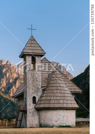 Church of Theth against Mountain Peaks of Albanian Alps Church of Theth against Mountain Peaks of Albanian Alps 130739798