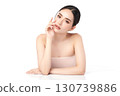 A beautiful young Asian woman with clean, fresh skin against a white background. Skincare, facial treatment, cosmetology, beauty, and spa. An elegant portrait of an Asian woman. 130739886