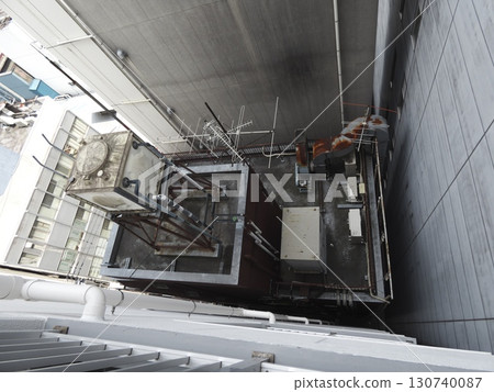 A view from directly above of the cluttered rooftops that spread out between the buildings 130740087