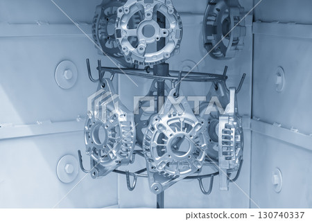 Close up scene cleaning and etching surface process the generator parts in sandblast machine. Close up scene cleaning and etching surface process the generator parts in sandblast machine. 130740337