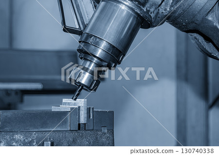The chamfer milling process on NC milling machine with chamfer tools in the light blue scene. The chamfer milling process on NC milling machine with chamfer tools in the light blue scene. 130740338