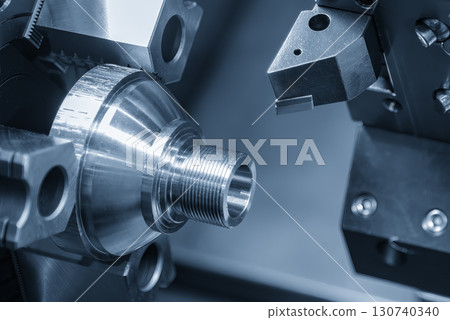 The CNC lathe machine forming  cutting the metal shaft parts. 130740340