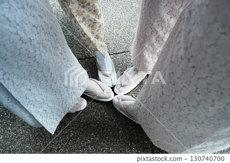 Four women in lace kimonos standing close together. Kyoto, Japan 130740700