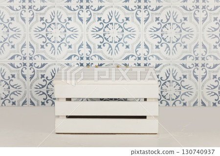 Wooden white podium on the table and square tile wall with ornament. Kitchen platform for product display presentation. Mock up for display or montage of product 130740937