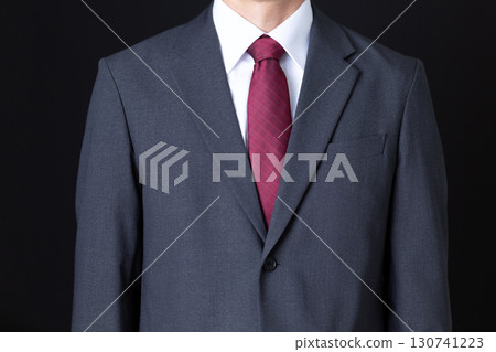 Middle-aged male businessman in a suit Middle-aged male businessman in a suit 130741223