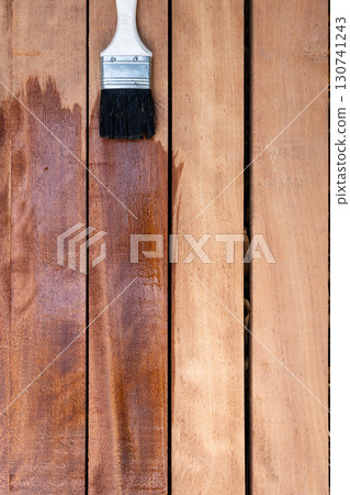 Paint brush and wood material in construction work. 130741243