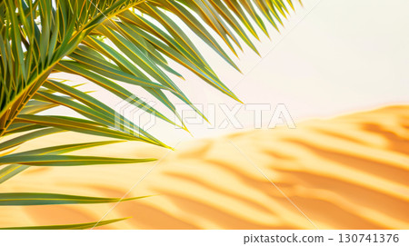 Sunlit palm leaf casting soft shadows on golden sand, capturing essence of tropical getaway. Ideal for promoting vacations, travel destinations, and relaxation in paradise-like settings. Copy space Sunlit palm leaf casting soft shadows on golden sand, capturing essence of tropical getaway. Ideal for promoting vacations, travel destinations, and relaxation in paradise-like settings. Copy space 130741376